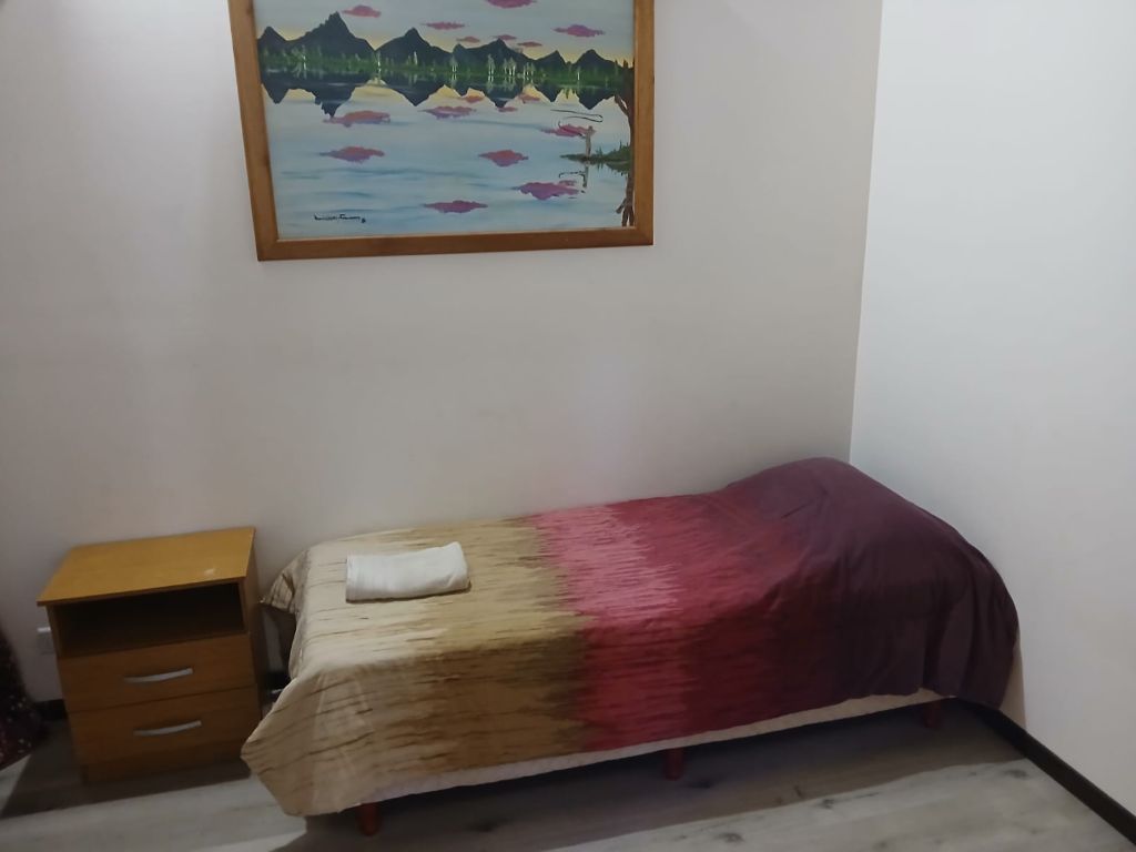 Dormitorio con camas simples · Casas y Deptos Castillo, El Bolsón